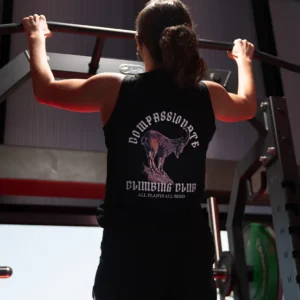 woman doing pullups in a plantbeast tank top